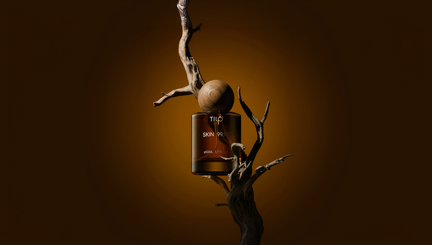 Tilo Skin 99.9% perfume resting on driftwood branches