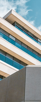 Modern building facade against a blue sky